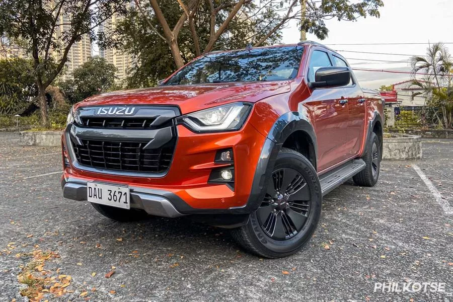 A picture of the Isuzu D-Max parked in the middle of a park.