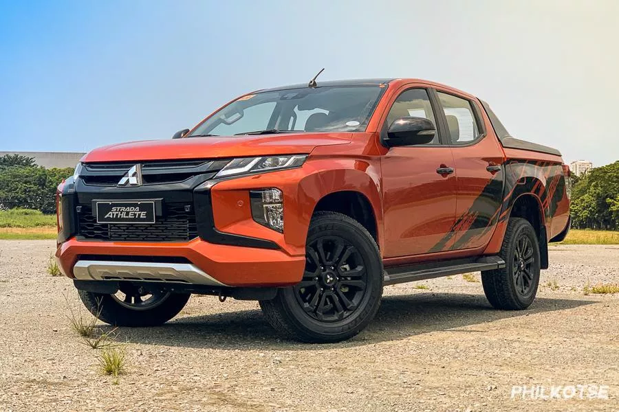 A picture of the Mitsubishi Strada Athlete parked in the middle of a field.