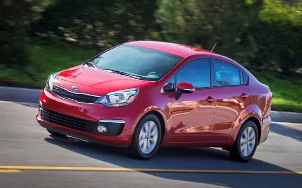 A Kia Rio sedan on the road