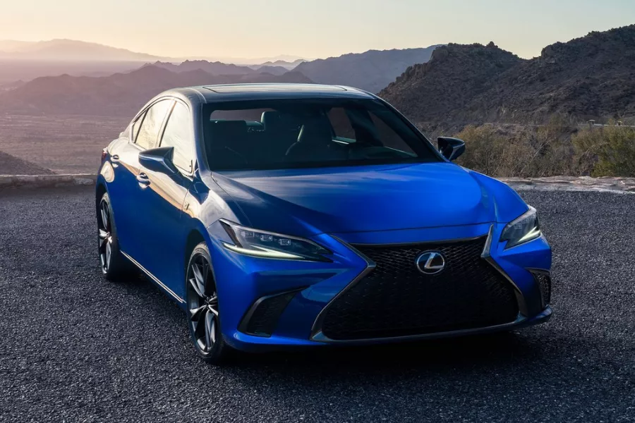 A picture of the Lexus ES in blue. Parked near a cliff.