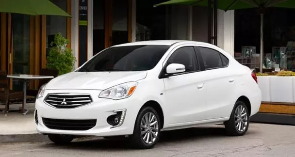 A white Mitsubishi Mirage G4 on the road