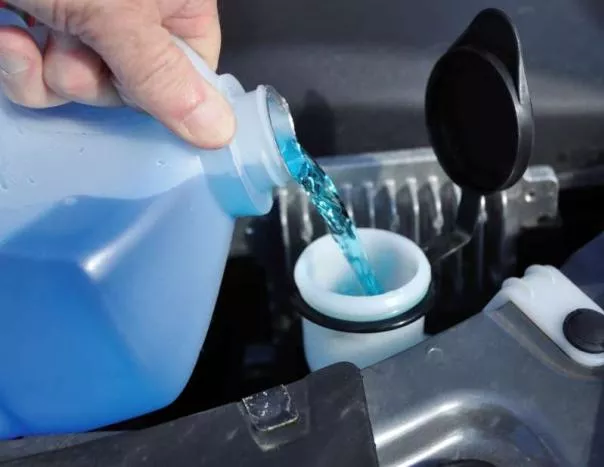 pouring car fluids