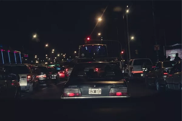 driving at night behind some vehicles