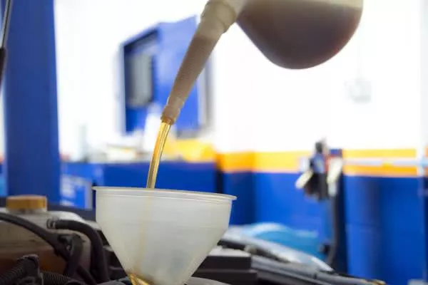 topping up engine oil