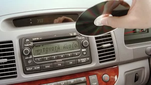 Putting a CD into car sound system