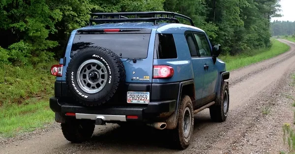 Gravel roads usually contains a lot of hidden potholes a car running on a gravel road