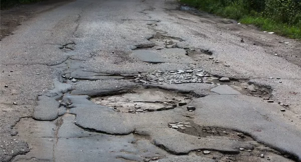 a bumpy road with many potholes