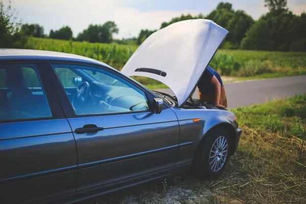 a broken car stopped at road side