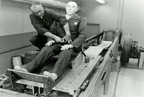 Dr. C Hunter Shelden checking retractable seat belts in 1955