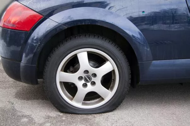 If you leave your car in the garage for a considerable period without using it, the car tire will eventually go flat A flat tire