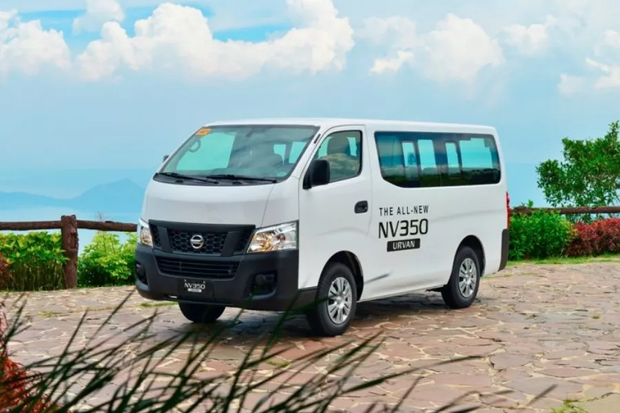 A picture of the Nissan Urvan at the parking area of a tourist spot