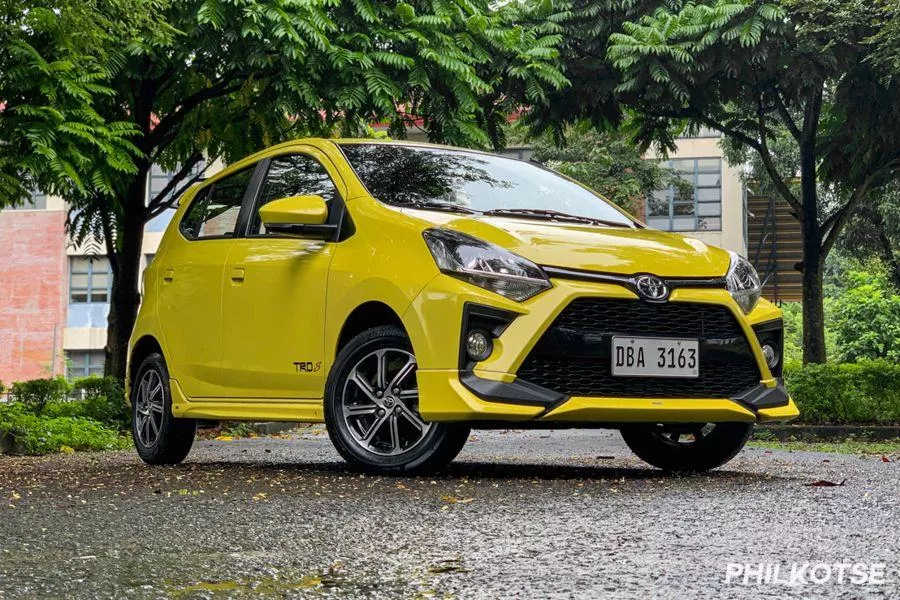 A picture of the Toyota Wigo parked near some buildings.